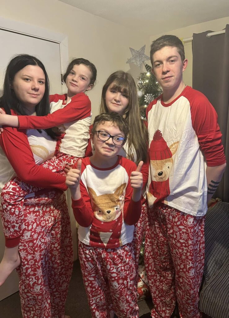 Let's Catch up Pcture of 5 children in christmas pyjamas